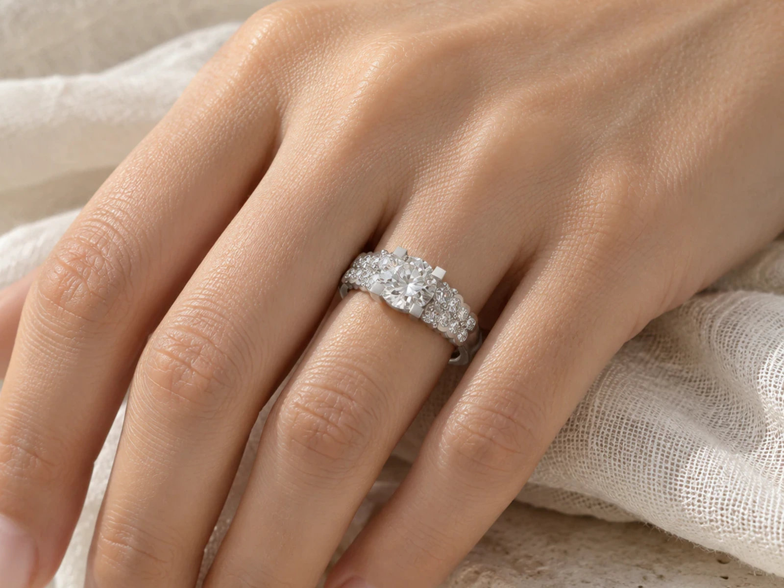 Round Center Triple-Row Pavé Ring in white gold, worn on a hand
